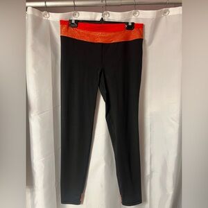 Victoria’s Secret Black Leggings with Red Sparkly Waistband. Size L. Never worn